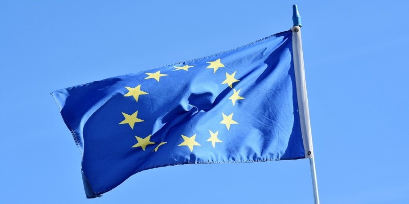 The European flag flying against a clear blue sky. The European flag flying against a clear blue sky.