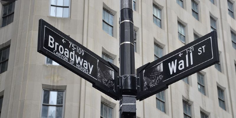 Street signs for Broadway and Wall Street Street signs for Broadway and Wall Street