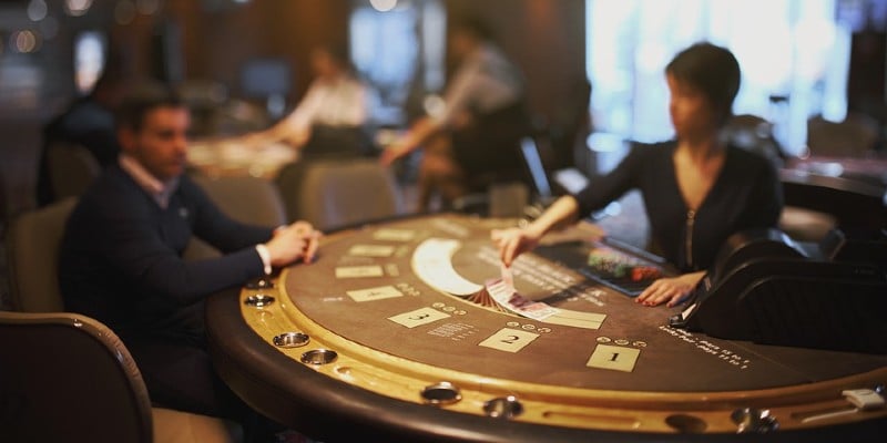 Croupier and player at table Croupier and player at table