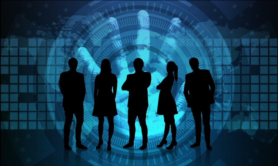 Silhouettes of people standing in front of cybersecurity imagery. Silhouettes of people standing in front of cybersecurity imagery.