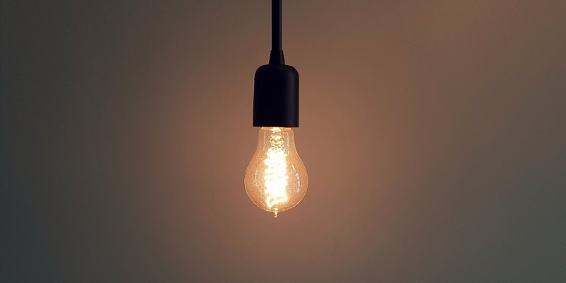Lit lightbulb hanging Lit lightbulb hanging