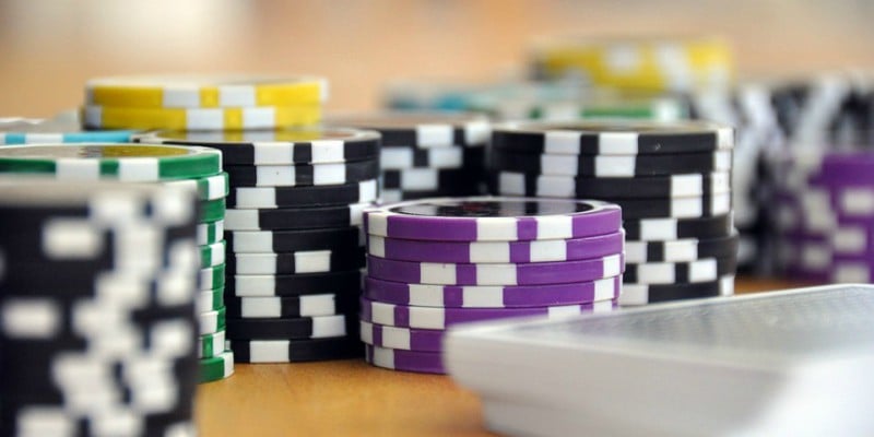Poker chips and a deck of cards Poker chips and a deck of cards