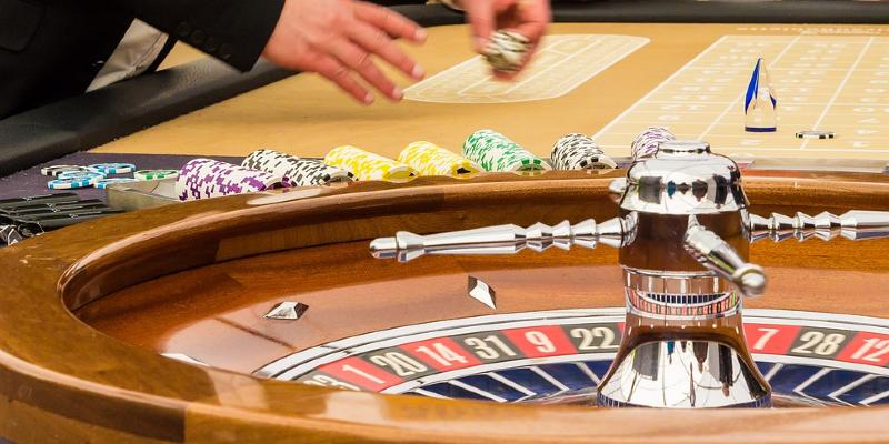 Roulette croupier at table Roulette croupier at table